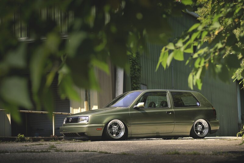 Green Hatchback Car — Calm, Afternoon