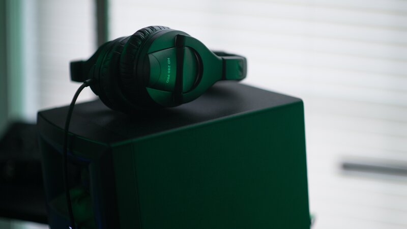 green headphones on a box