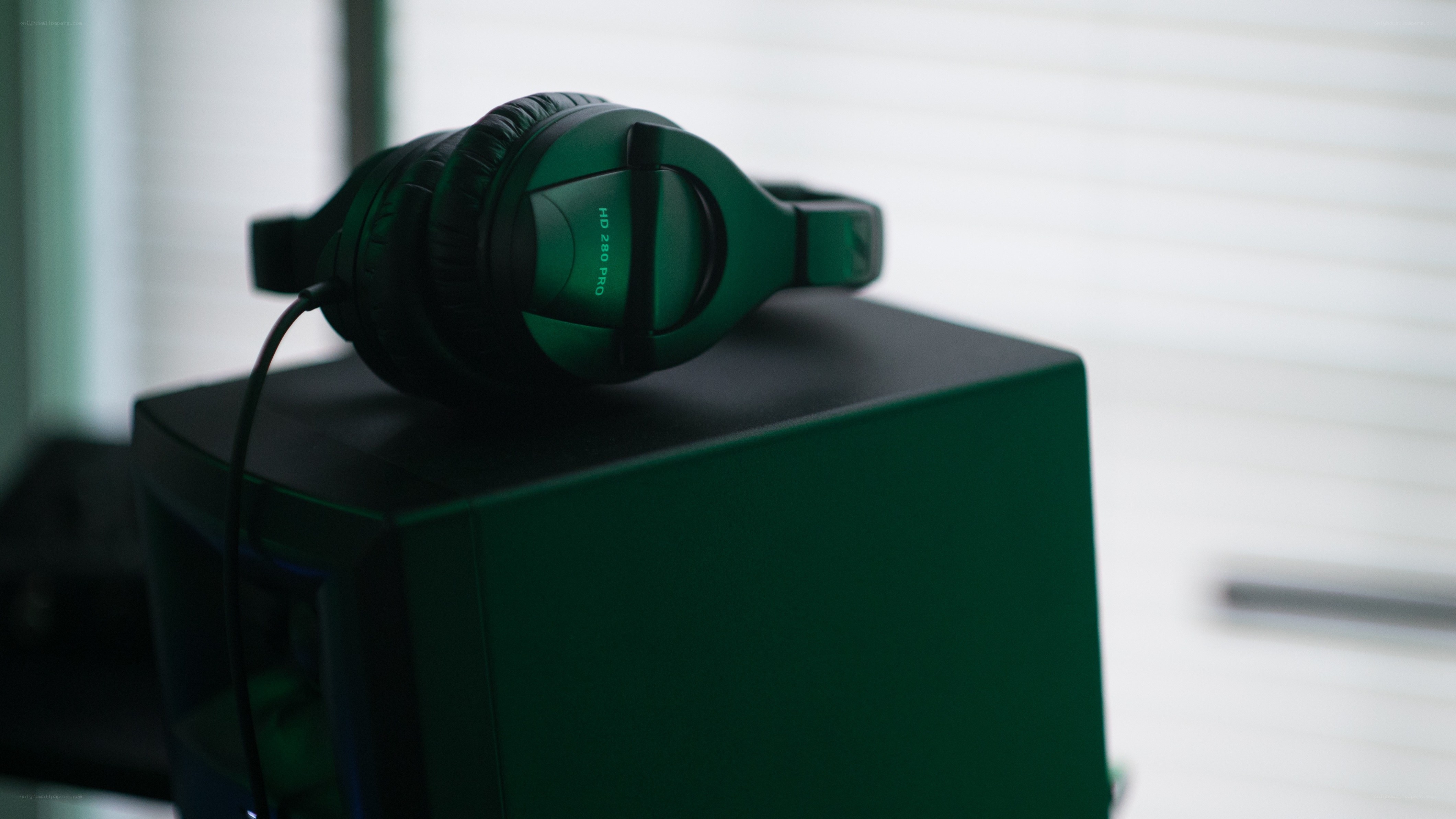 green headphones on a box