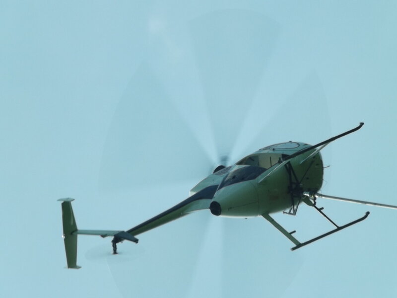 Green Helicopter in Flight