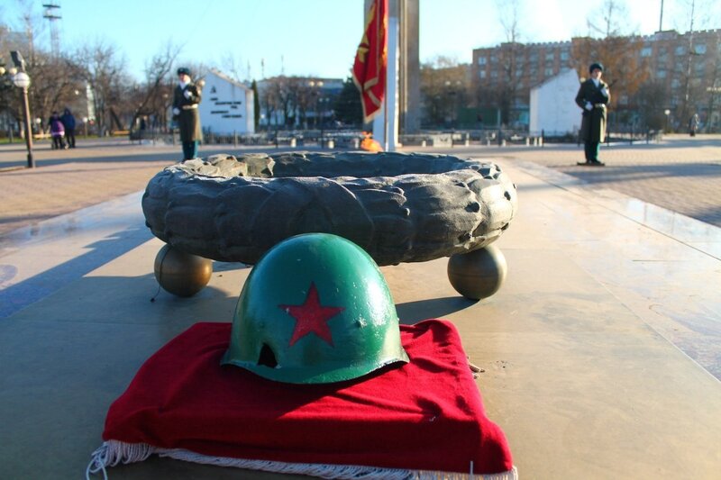 Green Helmet on Red Cloth