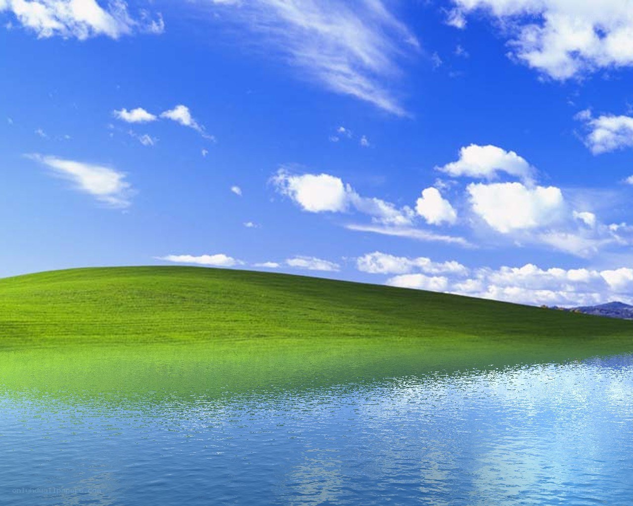 Green hill and blue sky