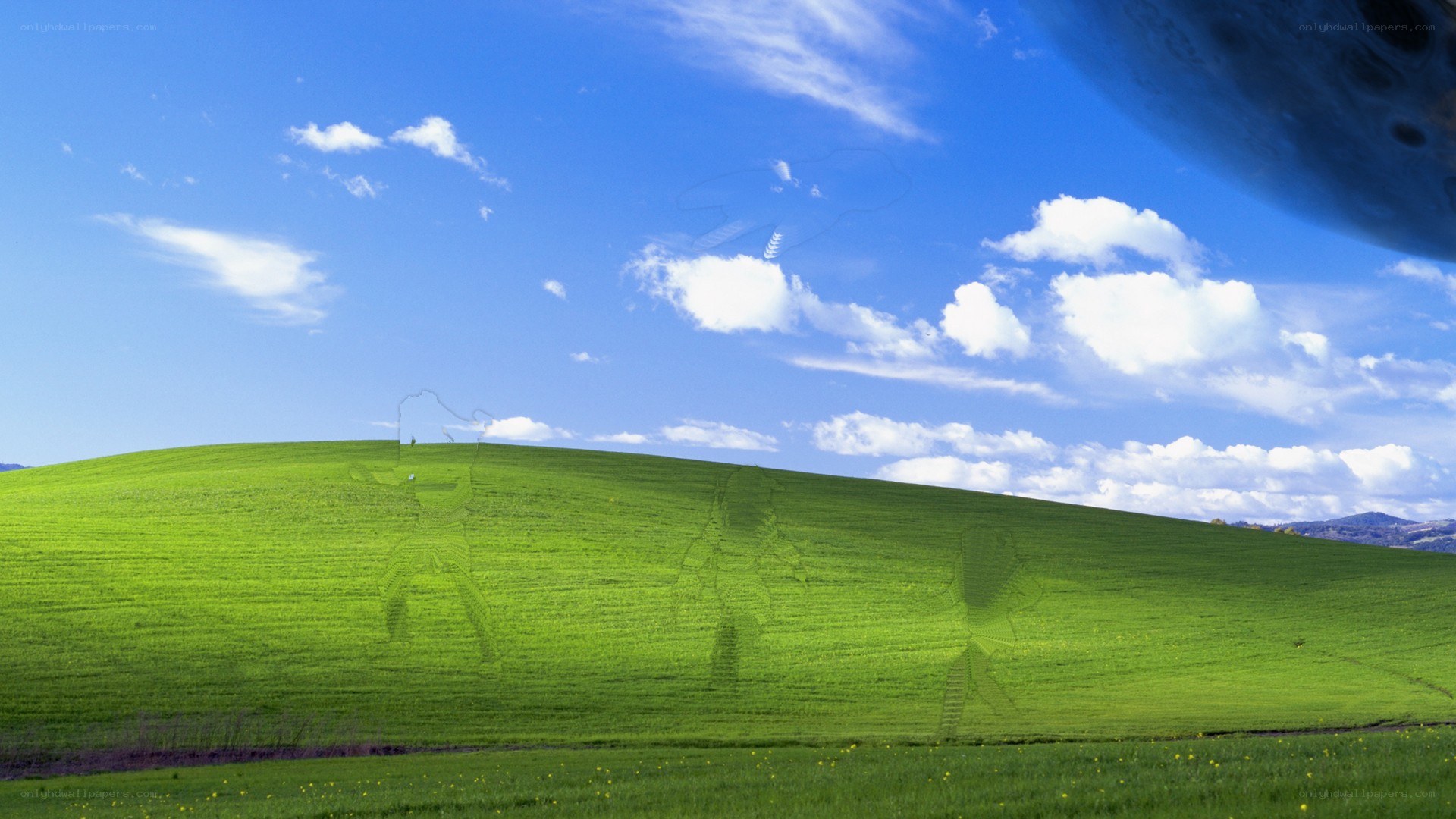 Green hill under blue sky