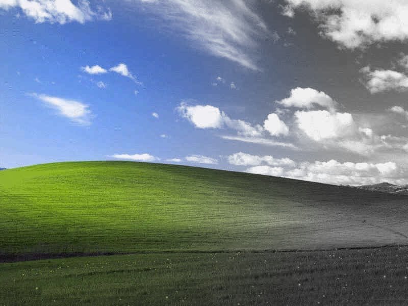 green hill under blue sky