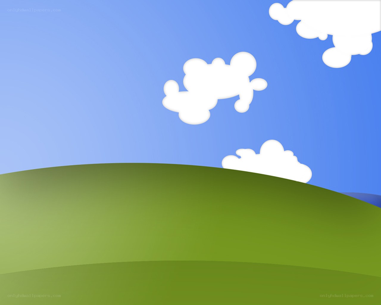 green hill under blue sky