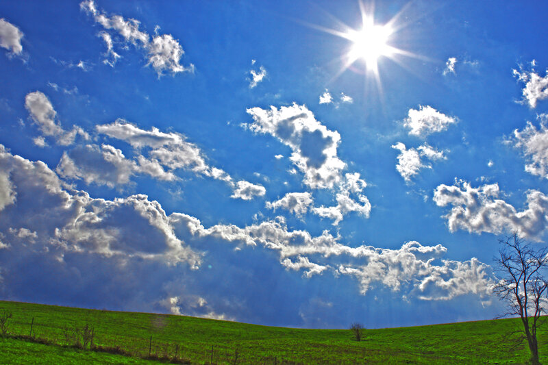 Green Hill under Blue Sky — Dramatic