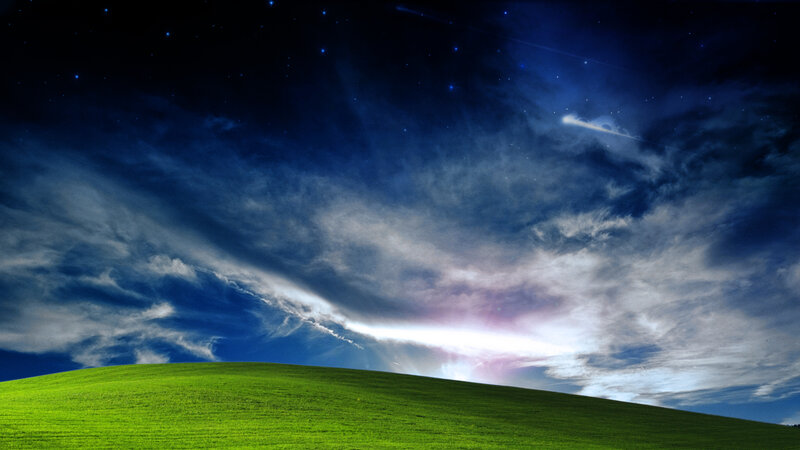 Green hill under starry sky