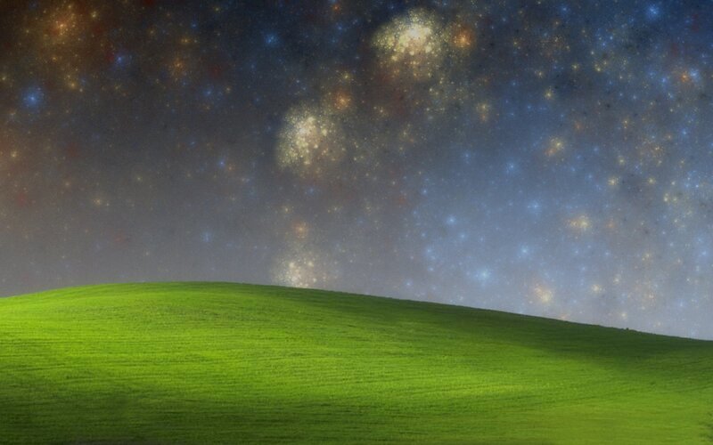 green hill under starry sky