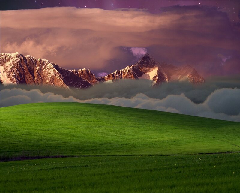 green hill with mountains