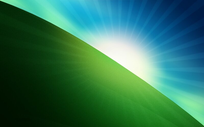 green hill with sunburst