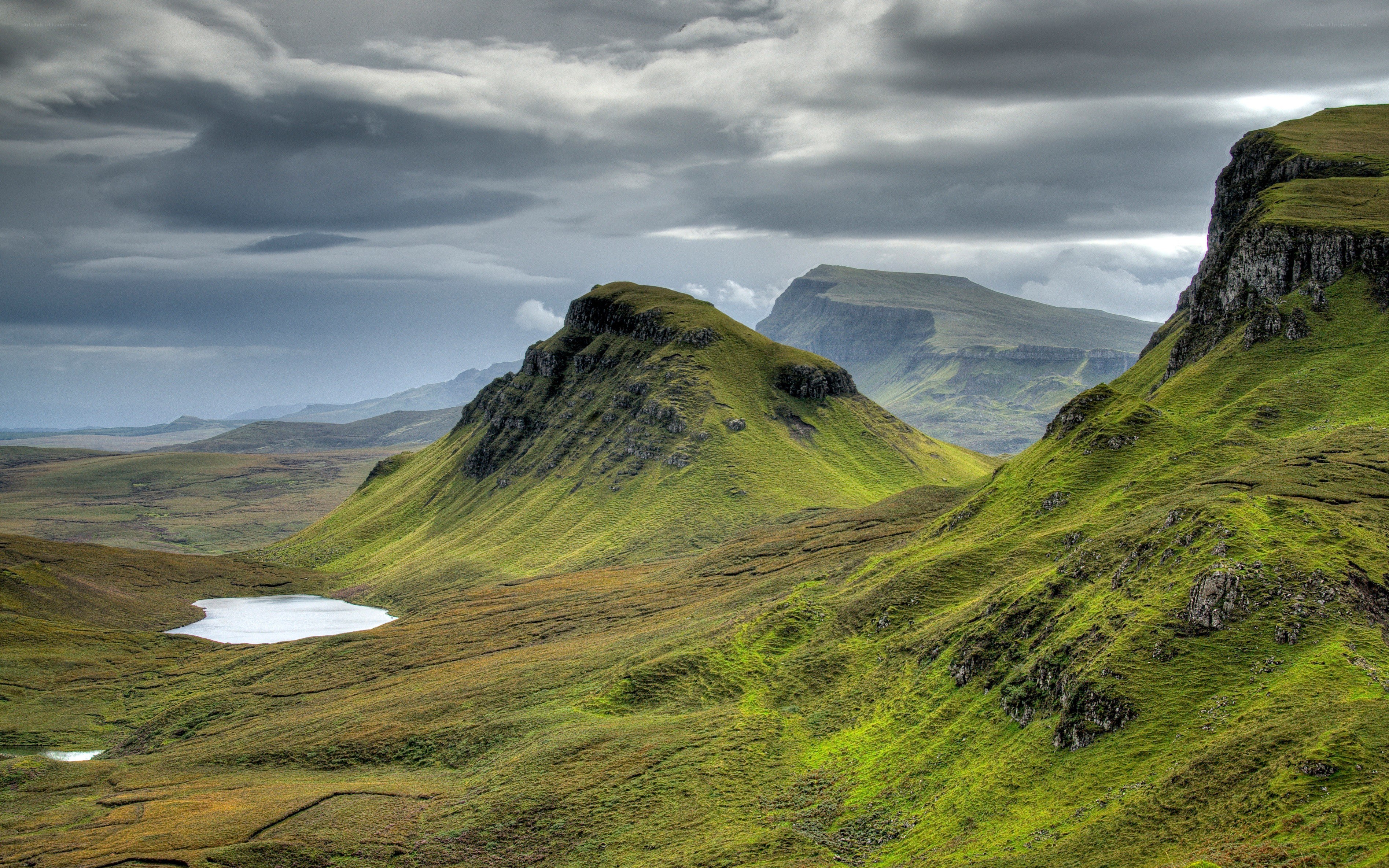 Green hills and cloudy sky
