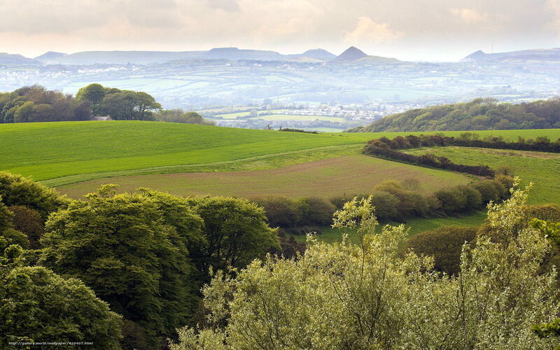 green hills and distant mountains