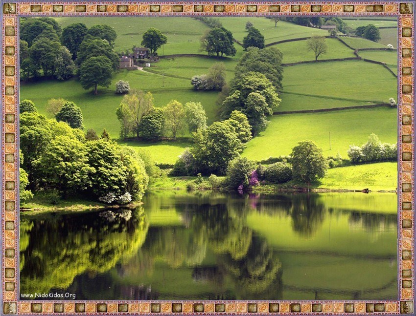 Green hills and lake reflection