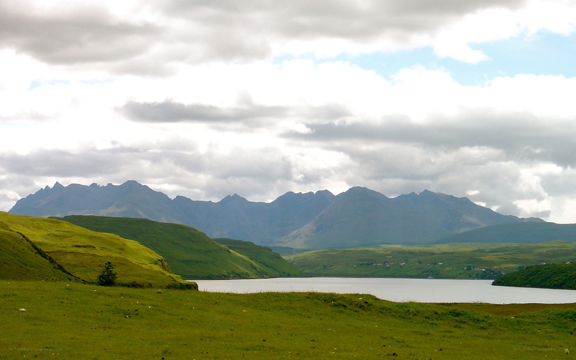 Green hills and mountain lake