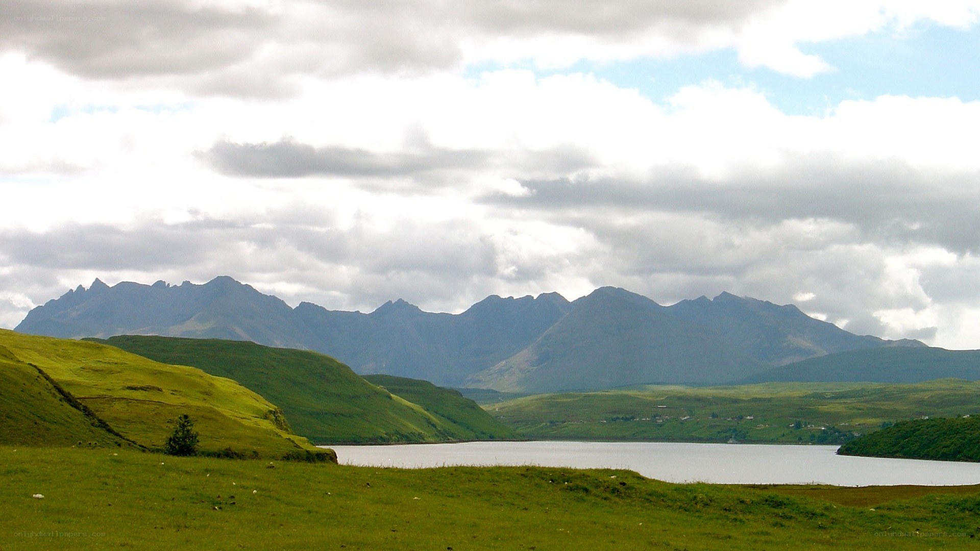 Green hills and mountain lake