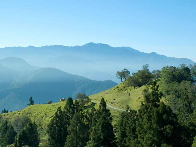 Green hills and mountain range