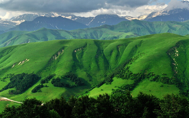 Green Hills and Mountains — Dramatic, Afternoon, Photograph, Snow-capped Peaks