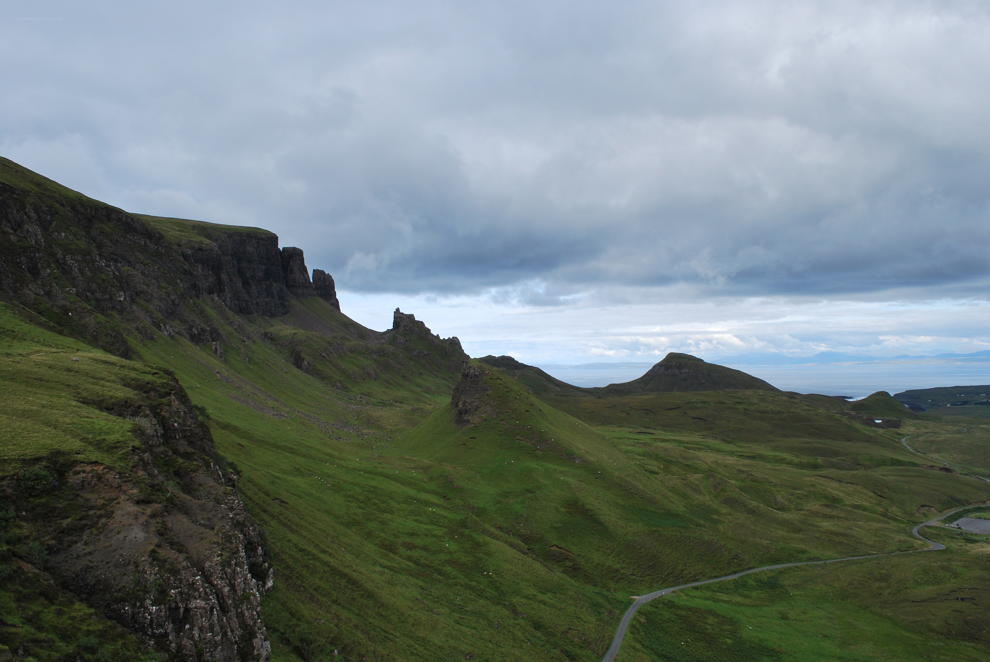 Green hills and rocky cliffs