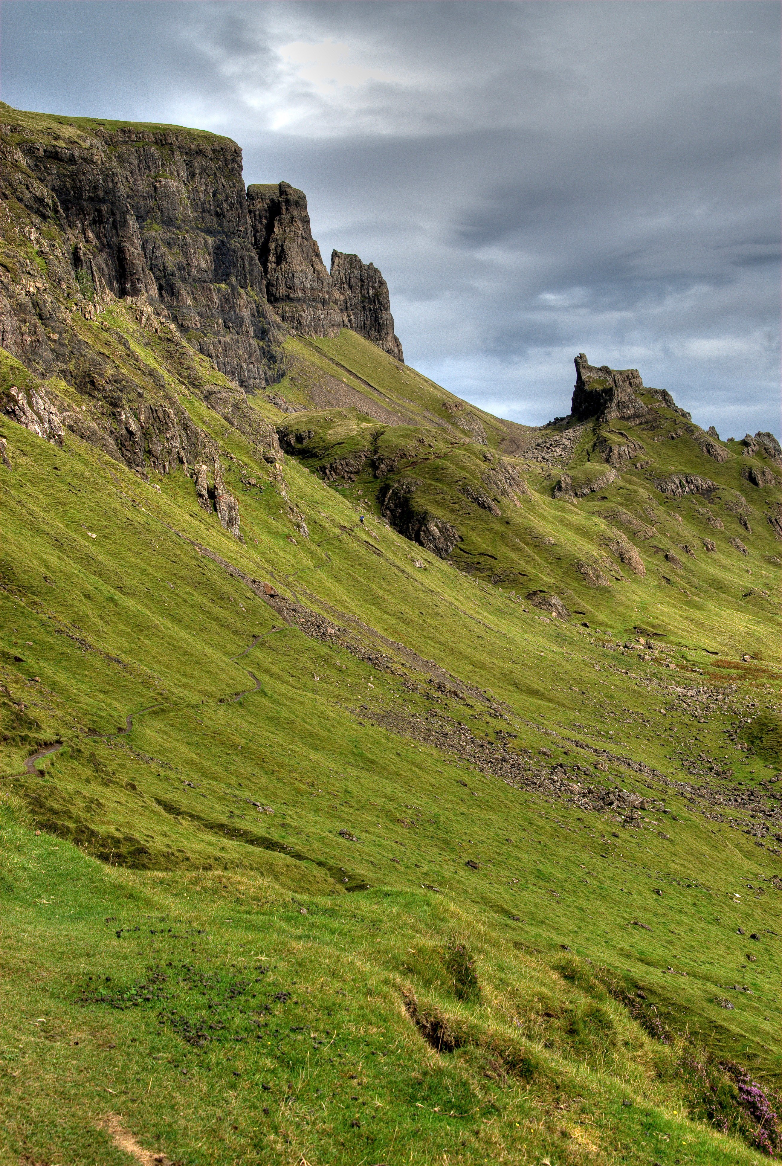 Green hills and rocky cliffs