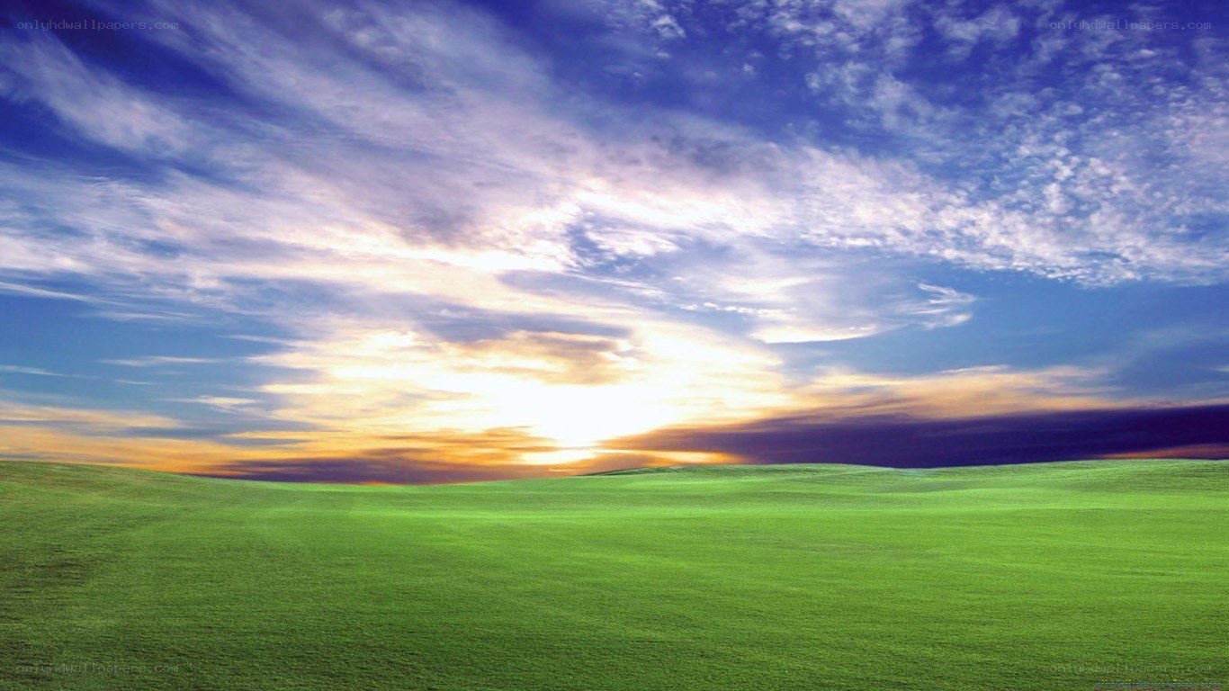 green hills at sunset