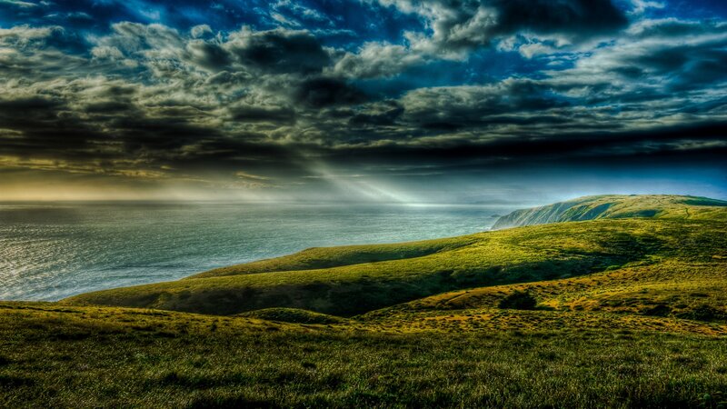 Green Hills Overlooking Ocean — Dramatic