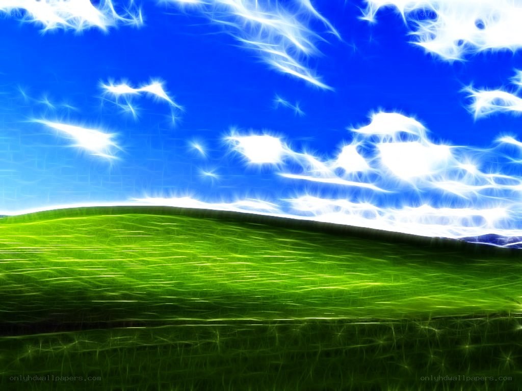 Green hills under a bright sky