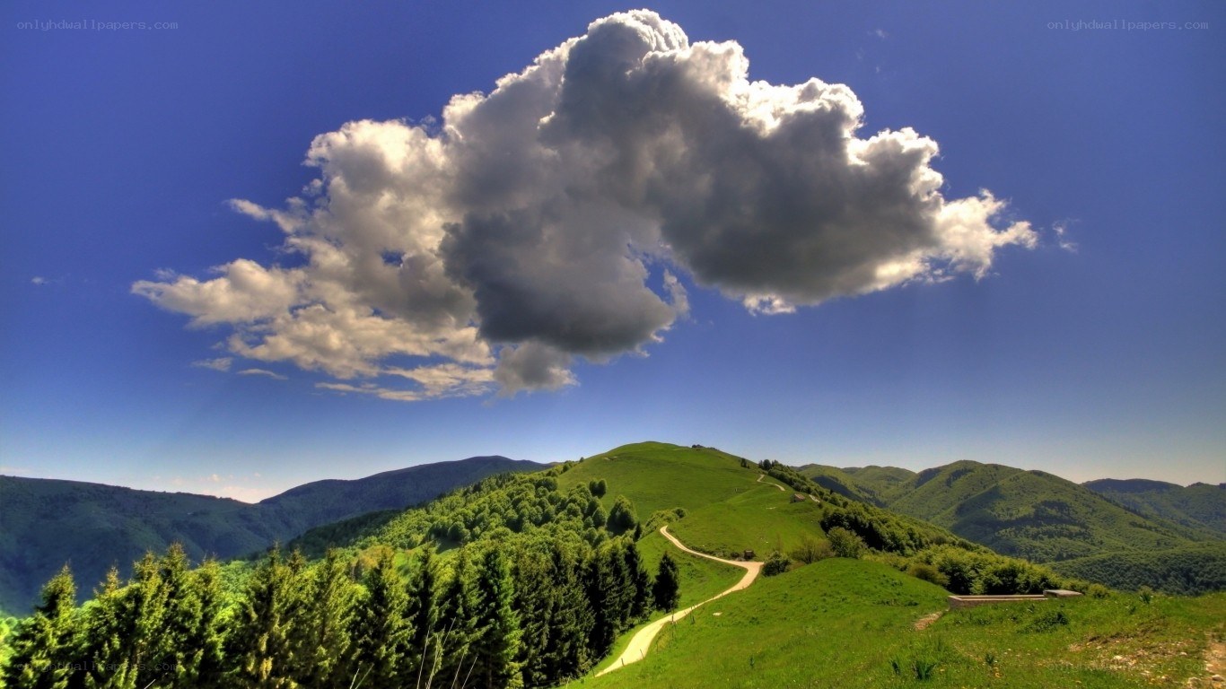 Green hills under a cloudy sky