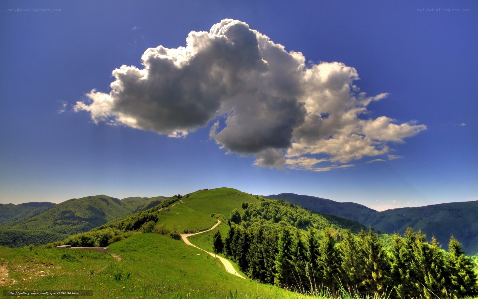 Green hills under a cloudy sky