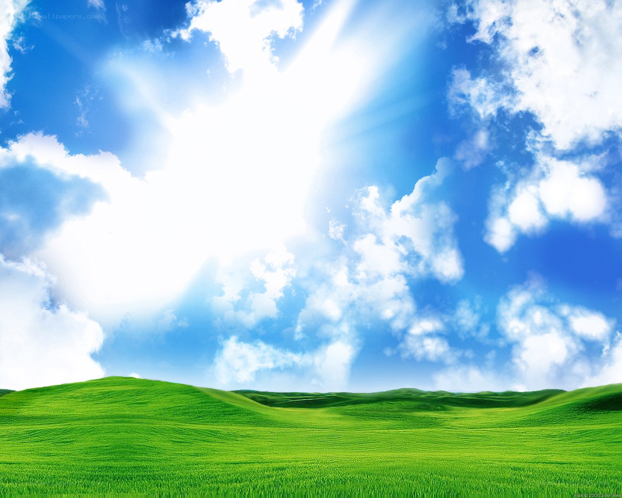 Green hills under a sunny sky