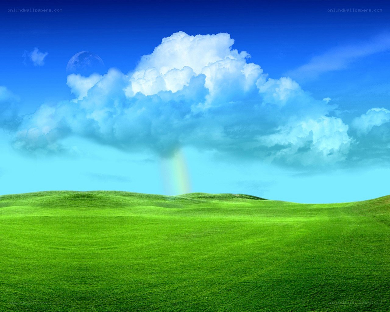Green hills under blue sky
