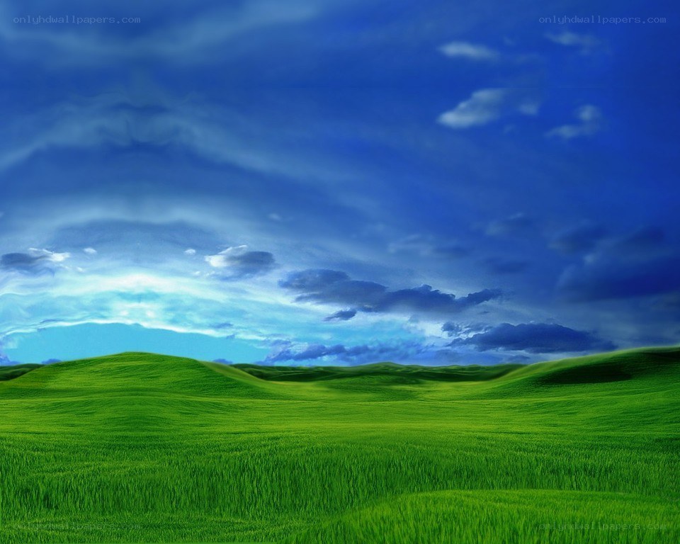 Green hills under blue sky