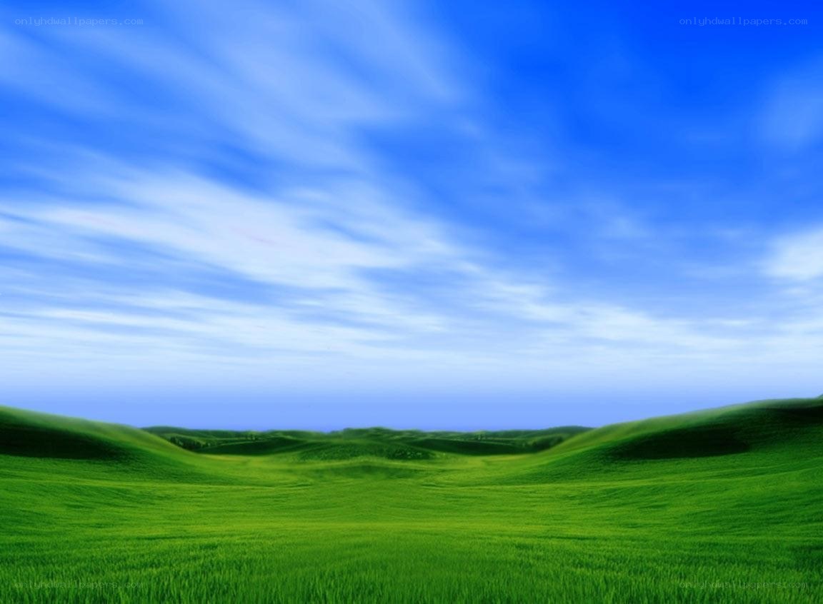 Green hills under blue sky