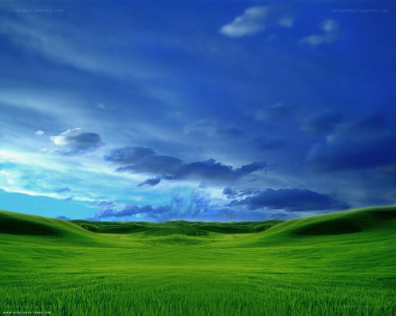 Green hills under blue sky