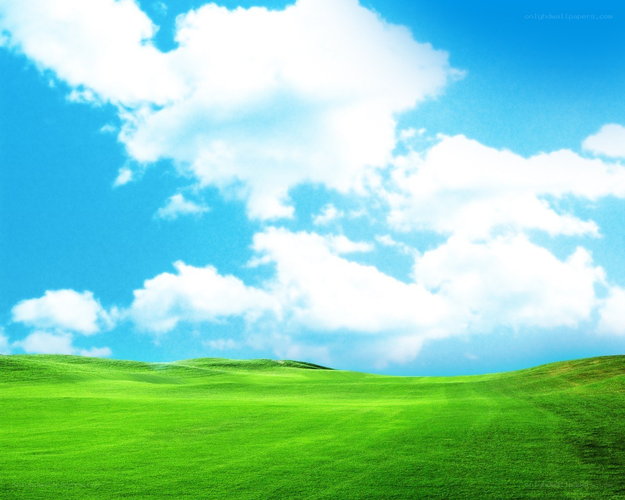 Green hills under blue sky
