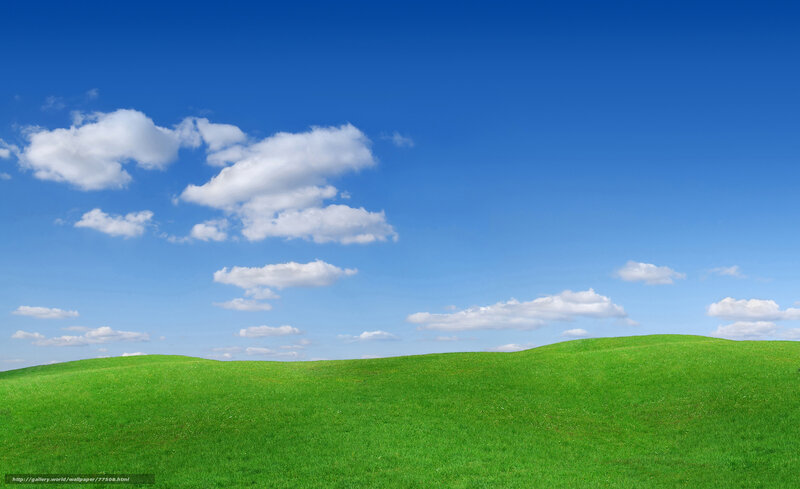 Green hills under blue sky
