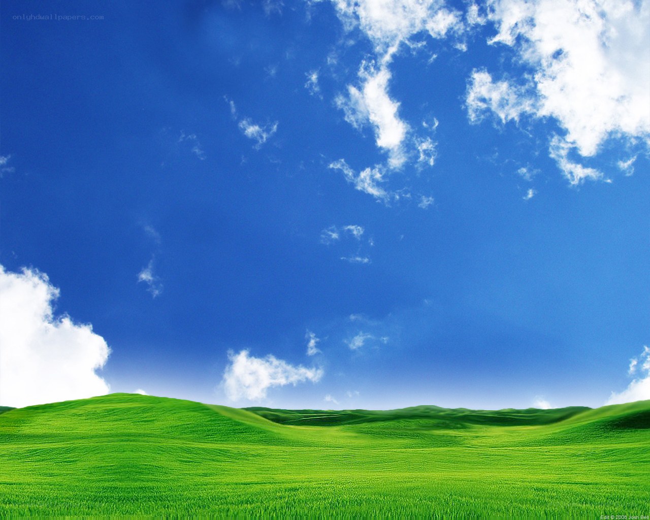 green hills under blue sky