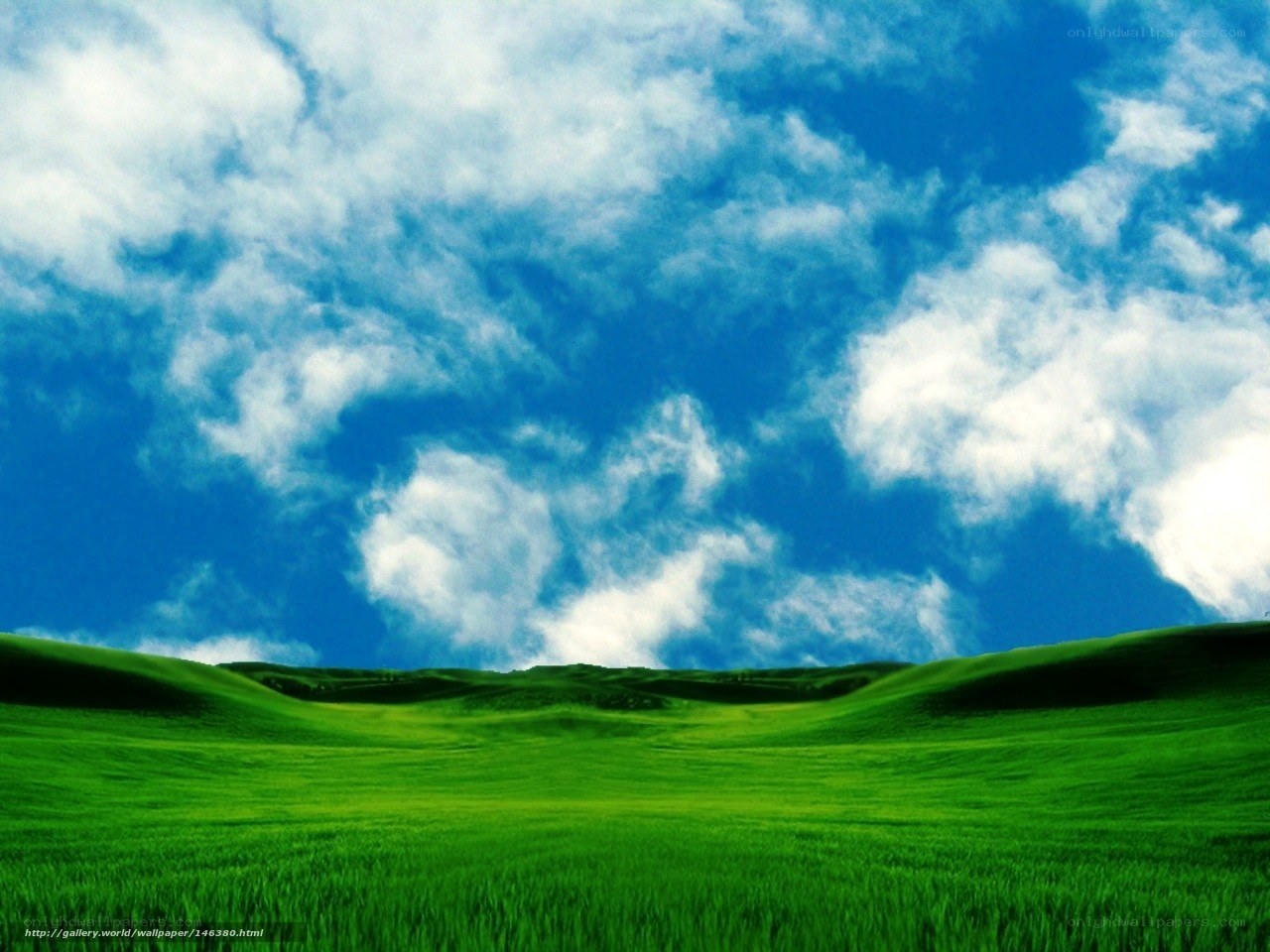 Green hills under blue sky