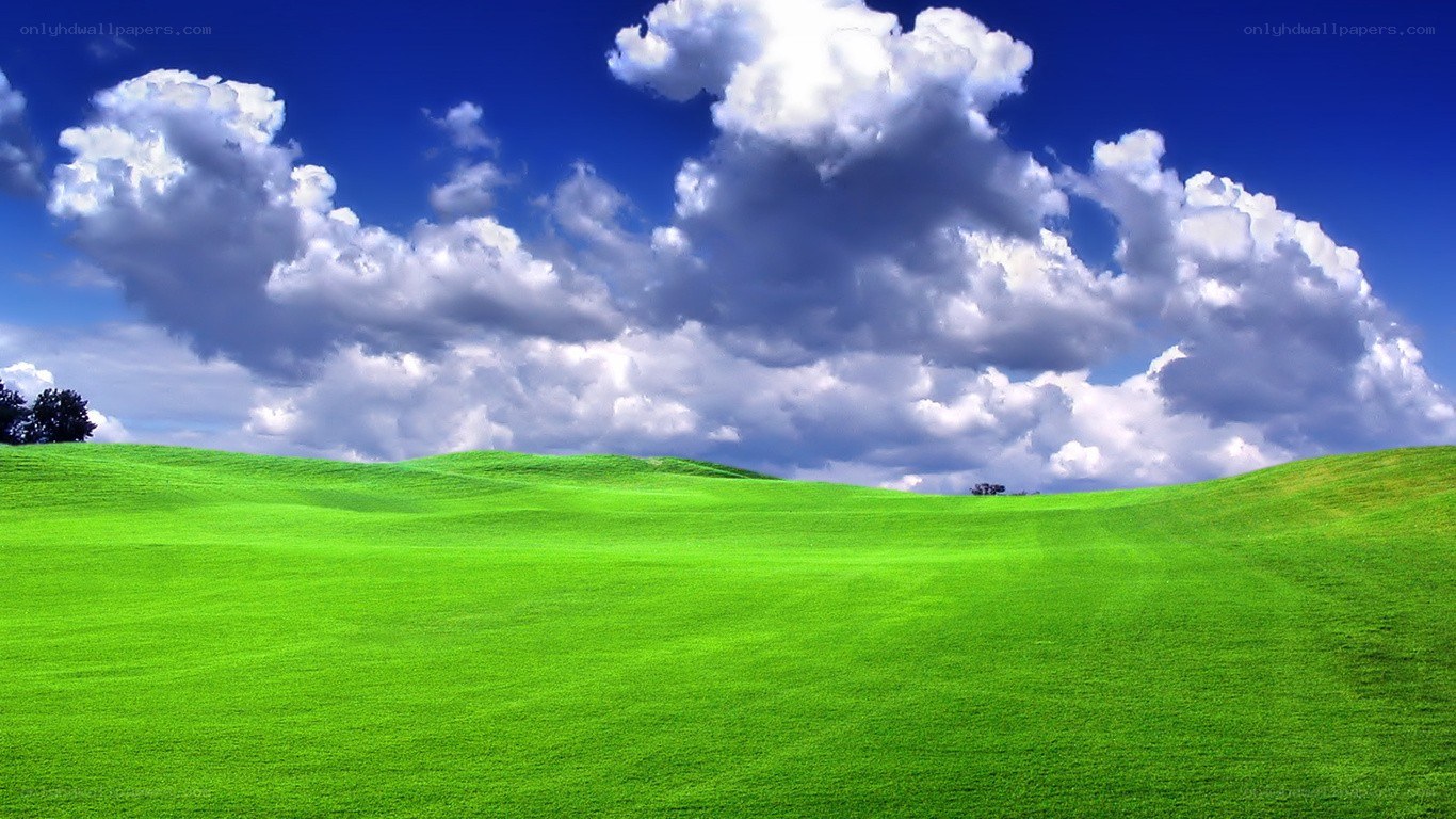 Green hills under blue sky