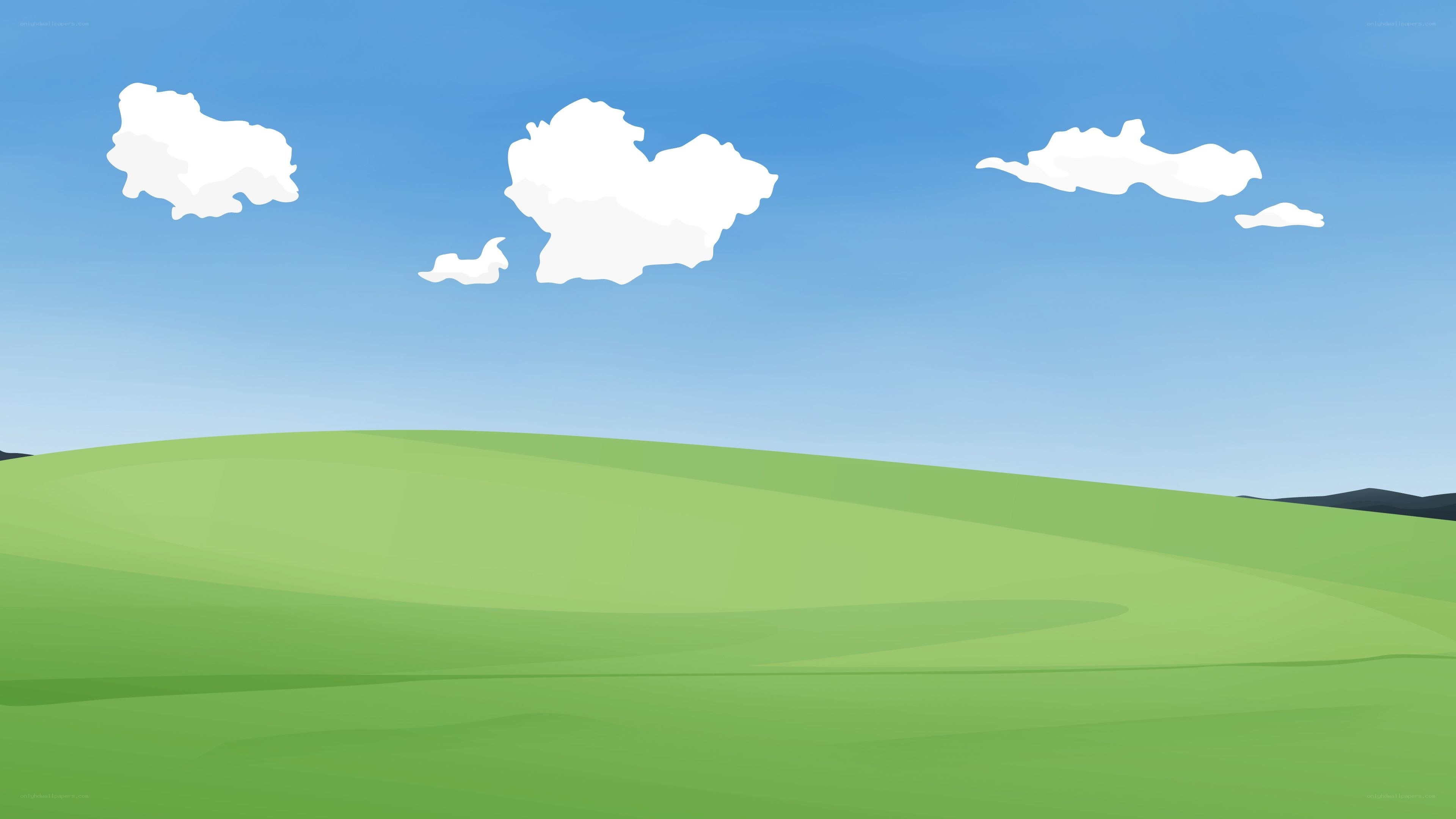 green hills under blue sky