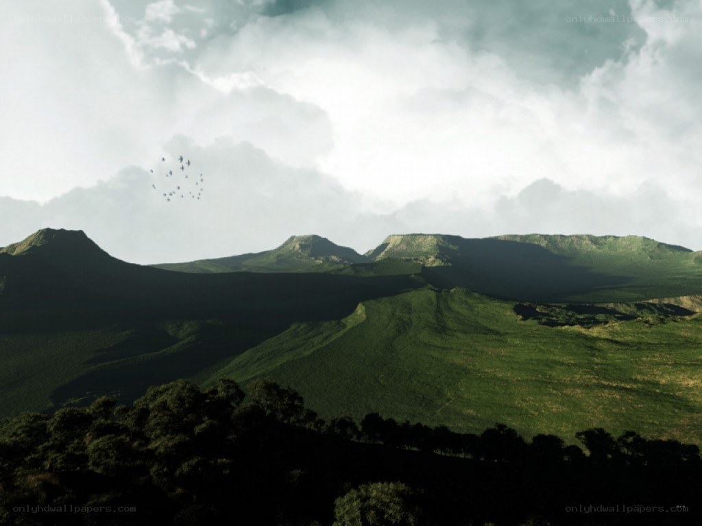 Green hills under cloudy sky