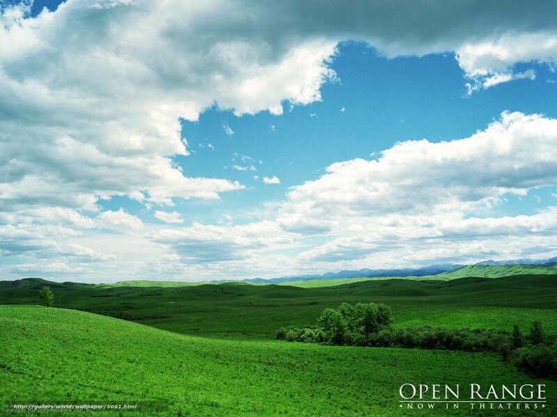 Green hills under cloudy sky