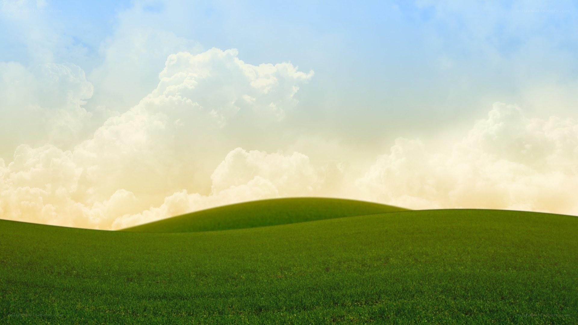 Green hills under cloudy sky