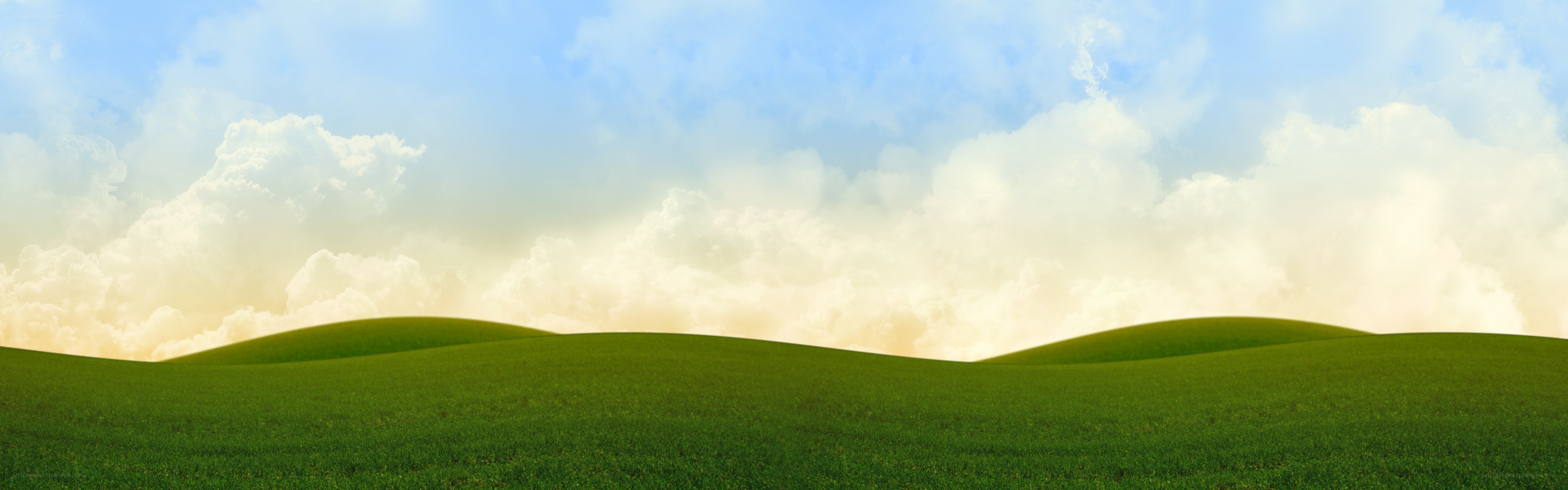 green hills under cloudy sky