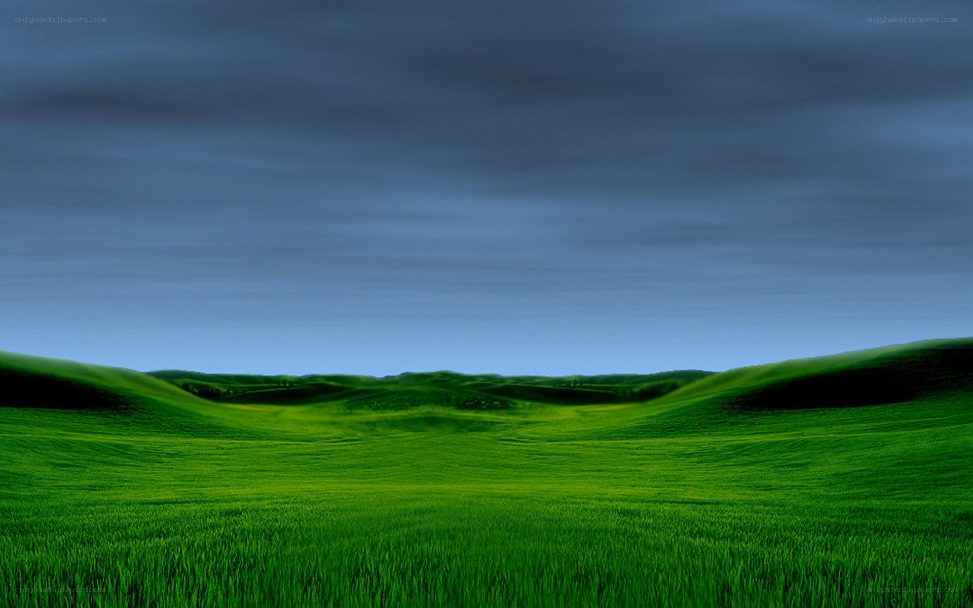 green hills under cloudy sky
