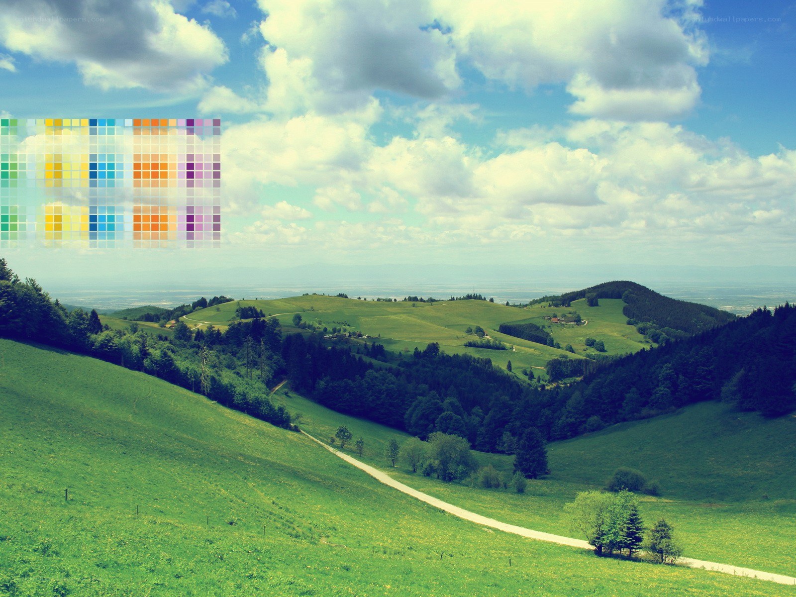 Green hills under cloudy sky