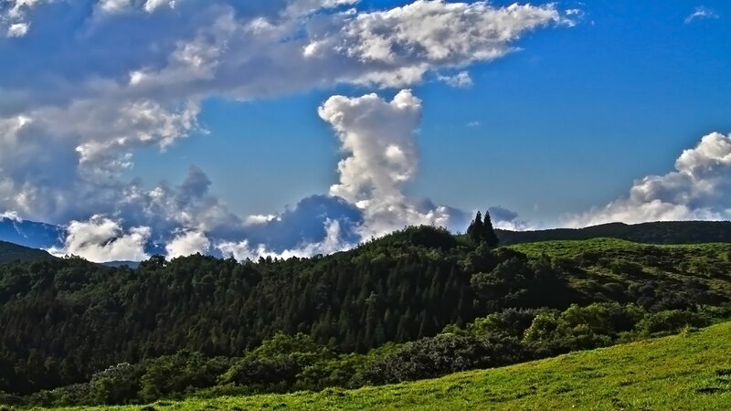 Green Hills under Cloudy Sky — Blue, Dramatic