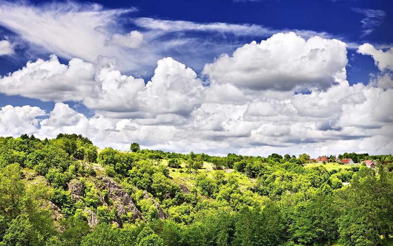 Green Hills under Cloudy Sky — Blue