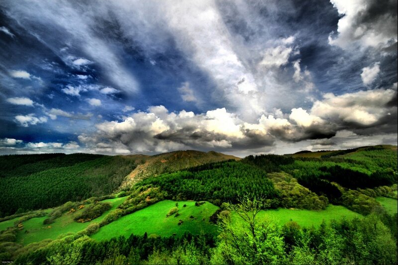 Green Hills under Cloudy Sky — Dramatic, Afternoon, Photograph