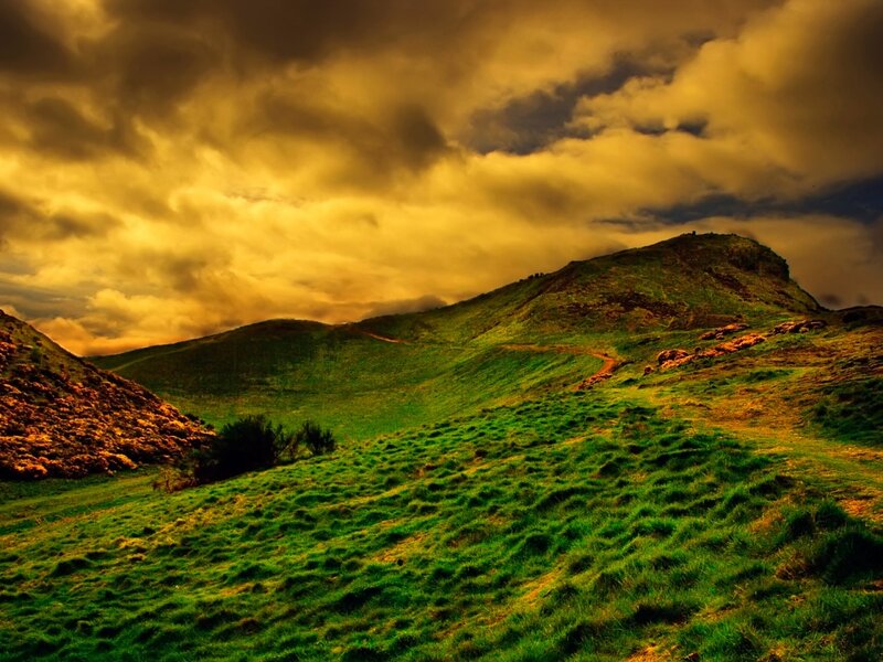 Green Hills under Cloudy Sky — Dramatic, Sunset, Photograph