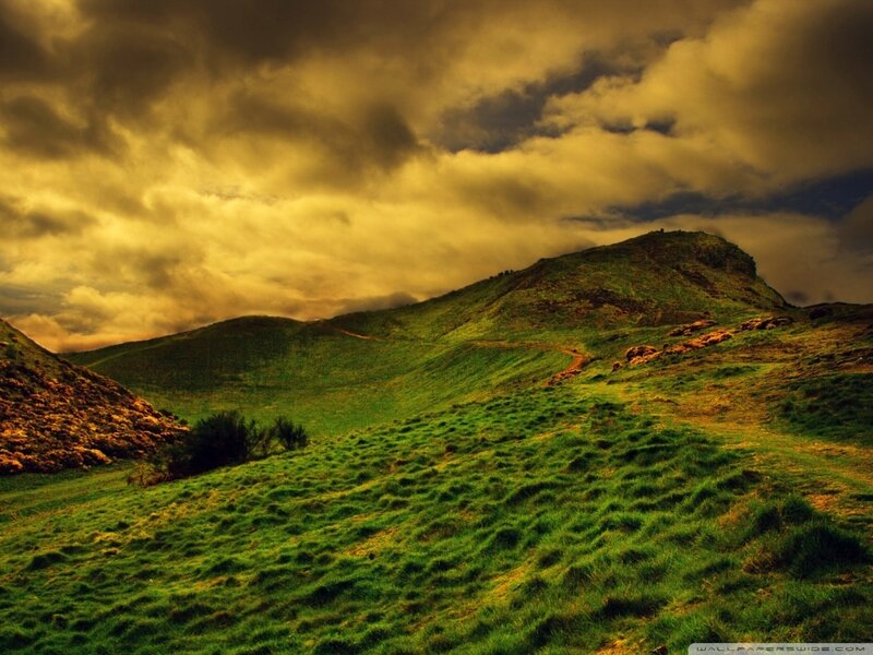 Green Hills under Cloudy Sky — Dramatic
